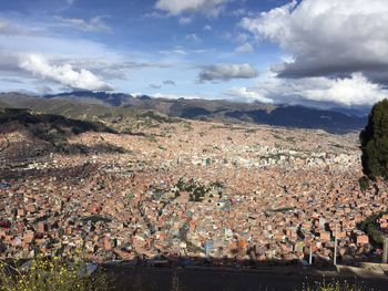 Scenic view of mountains against cloudy sky