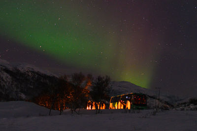 Scenic view of landscape against sky at night