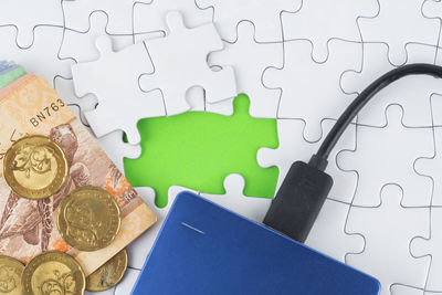 High angle view of coins on table