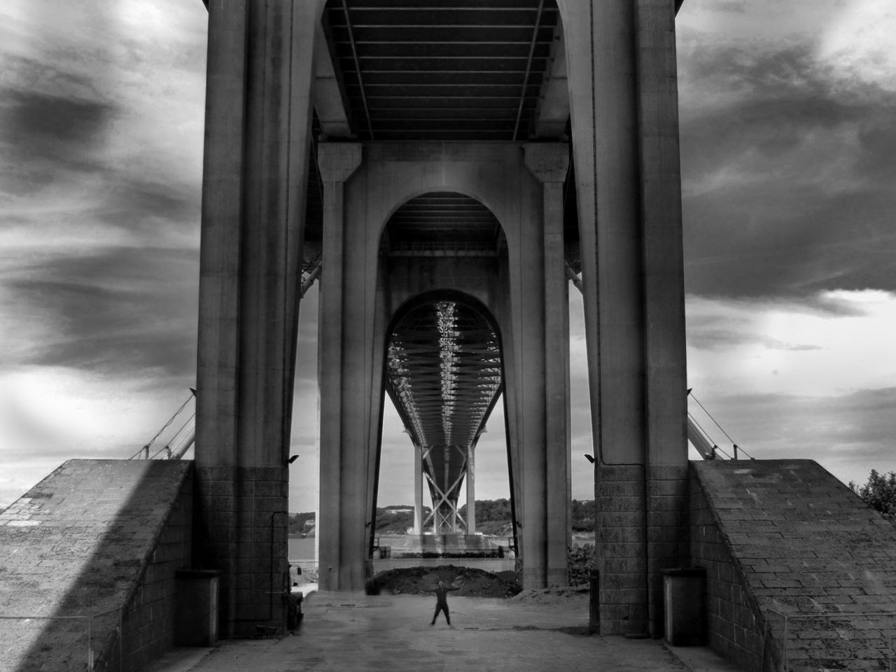 architecture, built structure, arch, sky, cloud - sky, low angle view, architectural column, bridge - man made structure, cloudy, connection, column, engineering, famous place, cloud, travel destinations, building exterior, the way forward, travel, day, colonnade