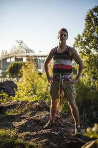 Two friends rock climbing together on summer day