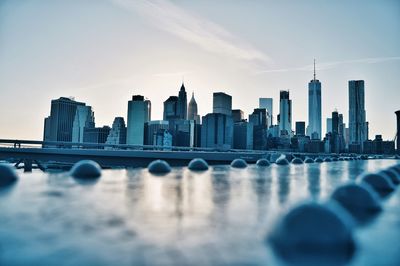 View of city skyline against sky during sunset