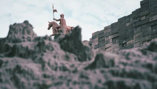 Low angle view of castle on wall against sky