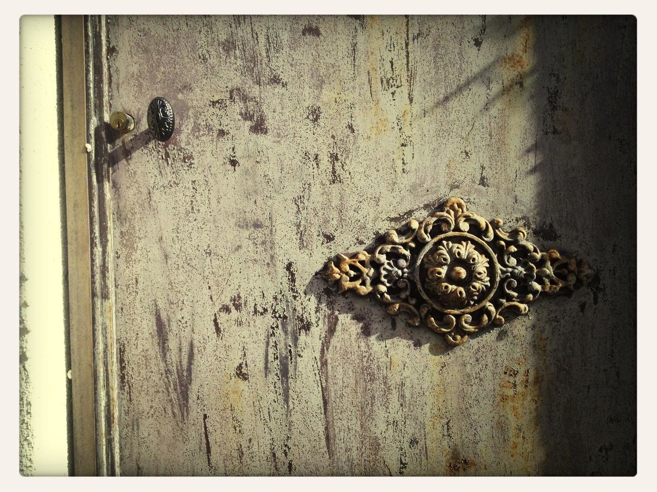 transfer print, auto post production filter, wall - building feature, close-up, old, metal, door, textured, rusty, wall, built structure, no people, day, art and craft, animal representation, outdoors, art, weathered, wood - material, creativity
