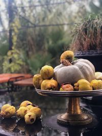 Close-up of pumpkin and fruits on cakestand