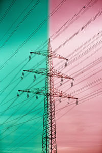 Low angle view of electricity pylon against sky