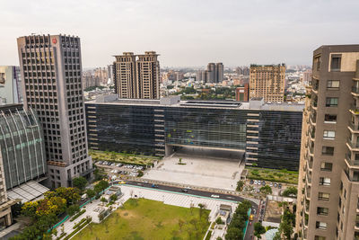 High angle view of buildings in city against sky