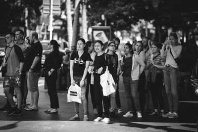 People standing on street in city