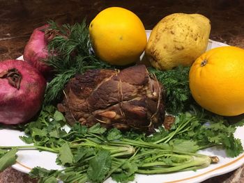 High angle view of fruits in plate on table