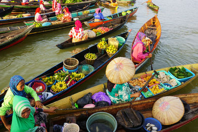 High angle view of people in boat at market