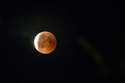 Low angle view of moon against sky at night