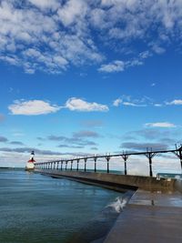 Bridge over sea against sky