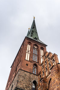 Low angle view of historic building against sky