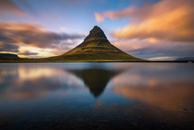 Scenic view of lake against sky during sunset