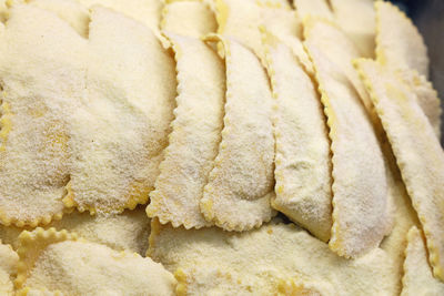 Close-up of raw pasta covered with flour