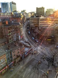 High angle view of road by buildings in city