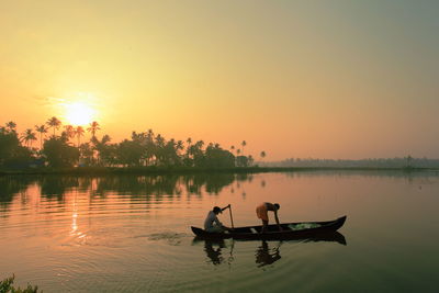 Scenic view of calm lake at sunset