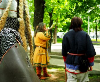 Rear view of people on tree