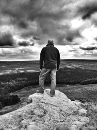 Scenic view of landscape against cloudy sky