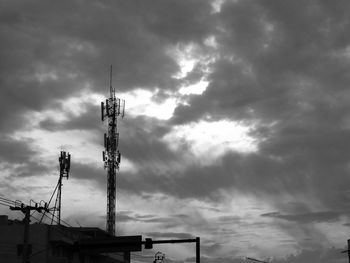 Low angle view of communications tower against sky