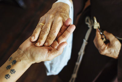 Close-up of man holding hands