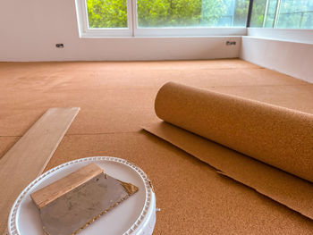 Cork panels are glued to the floor to insulate against footfall noise.
