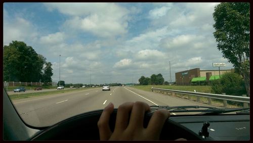 Road seen through car windshield