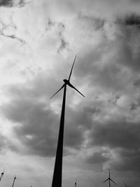 Low angle view of wind turbine against sky