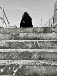 Portrait of man on staircase against sky