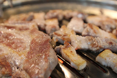 Korean grilled pork bbq or samgyeopsal-gui with charcoal at korean restaurant, busan, south korea