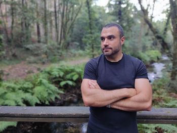 Portrait of young man hicking at the forest