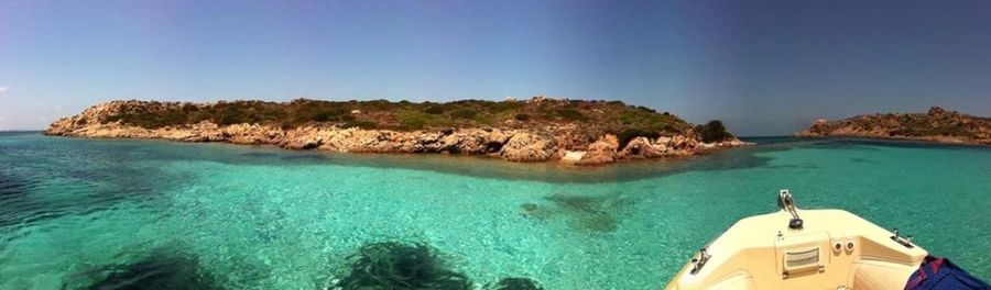Scenic view of sea against blue sky
