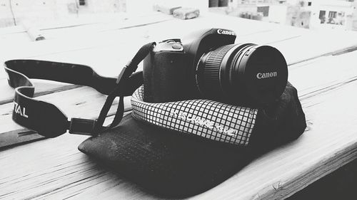 Close-up of camera on table