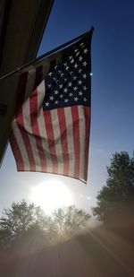 Low angle view of flag against sky