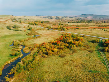 Aerial view of autumn landscape with hills and yellow trees