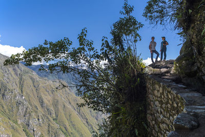 Couple on the inca trail path close to machu picchu