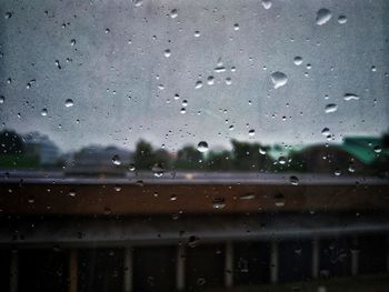 Full frame shot of wet glass window in rainy season