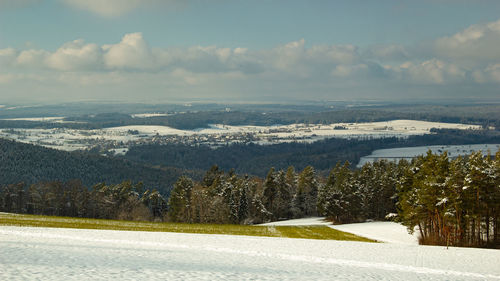 Scenic view of snowcapped mountains against sky