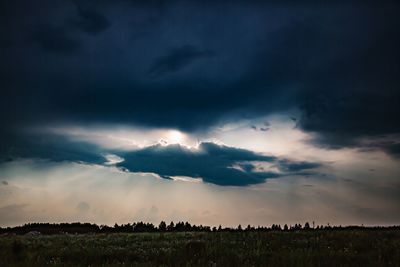 Scenic view of dramatic sky over land