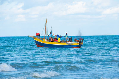 Boat in sea against sky