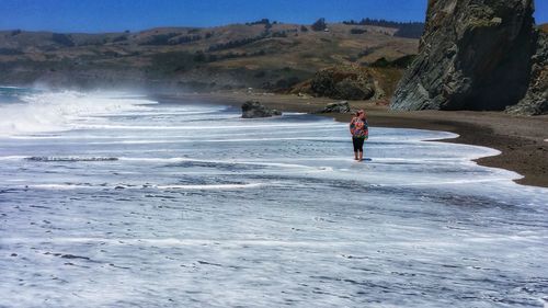 Woman standing at beach
