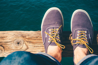 Low section of person standing on tiled floor
