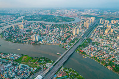 High angle view of river amidst buildings in city