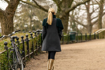 Rear view of woman walking at park