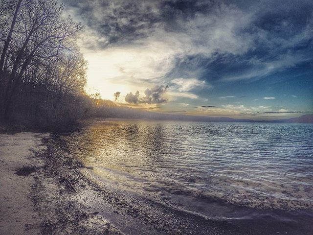 water, sky, tranquil scene, tranquility, scenics, sea, beauty in nature, cloud - sky, nature, horizon over water, beach, tree, idyllic, shore, cloud, cloudy, sunset, outdoors, non-urban scene, no people