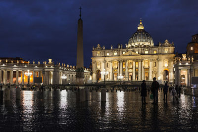 Reflection of building in water at night