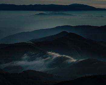 Scenic view of mountains against sky during sunset