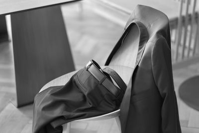 Close-up of clothes hanging on chair