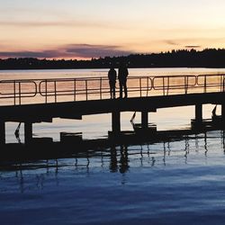 Silhouette of pier at sunset