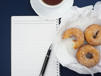 Directly above shot of coffee cup on paper